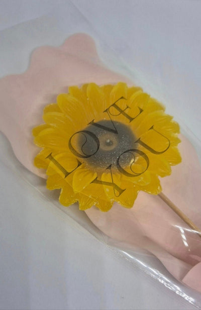 single sunflower wax melt in pink packaging 
