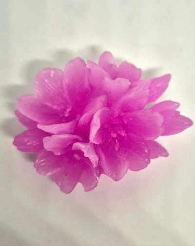 a single pink wax melt flower 