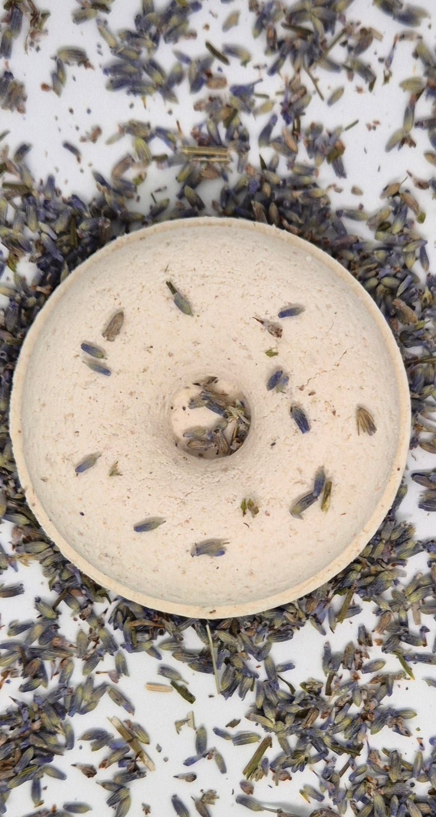 Lavender shower steamer on bed of lavender