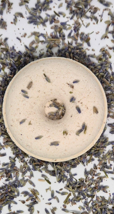 Lavender shower steamer on bed of lavender
