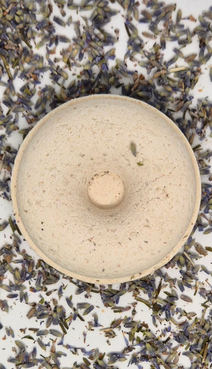 Lavender shower steamer on bed of lavender