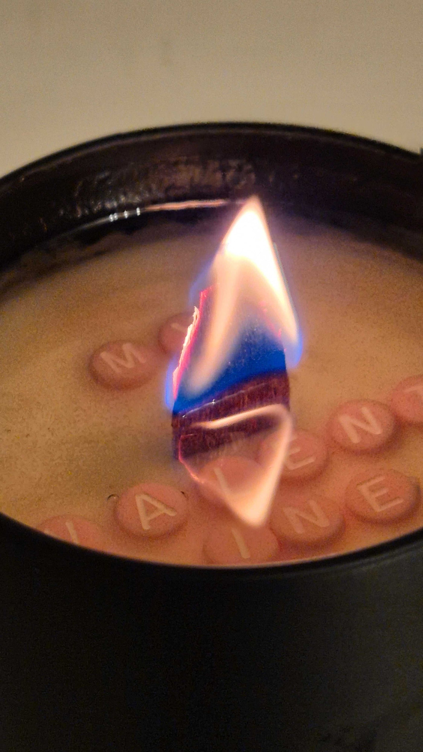 4oz Love letter candle, melting revealing the message