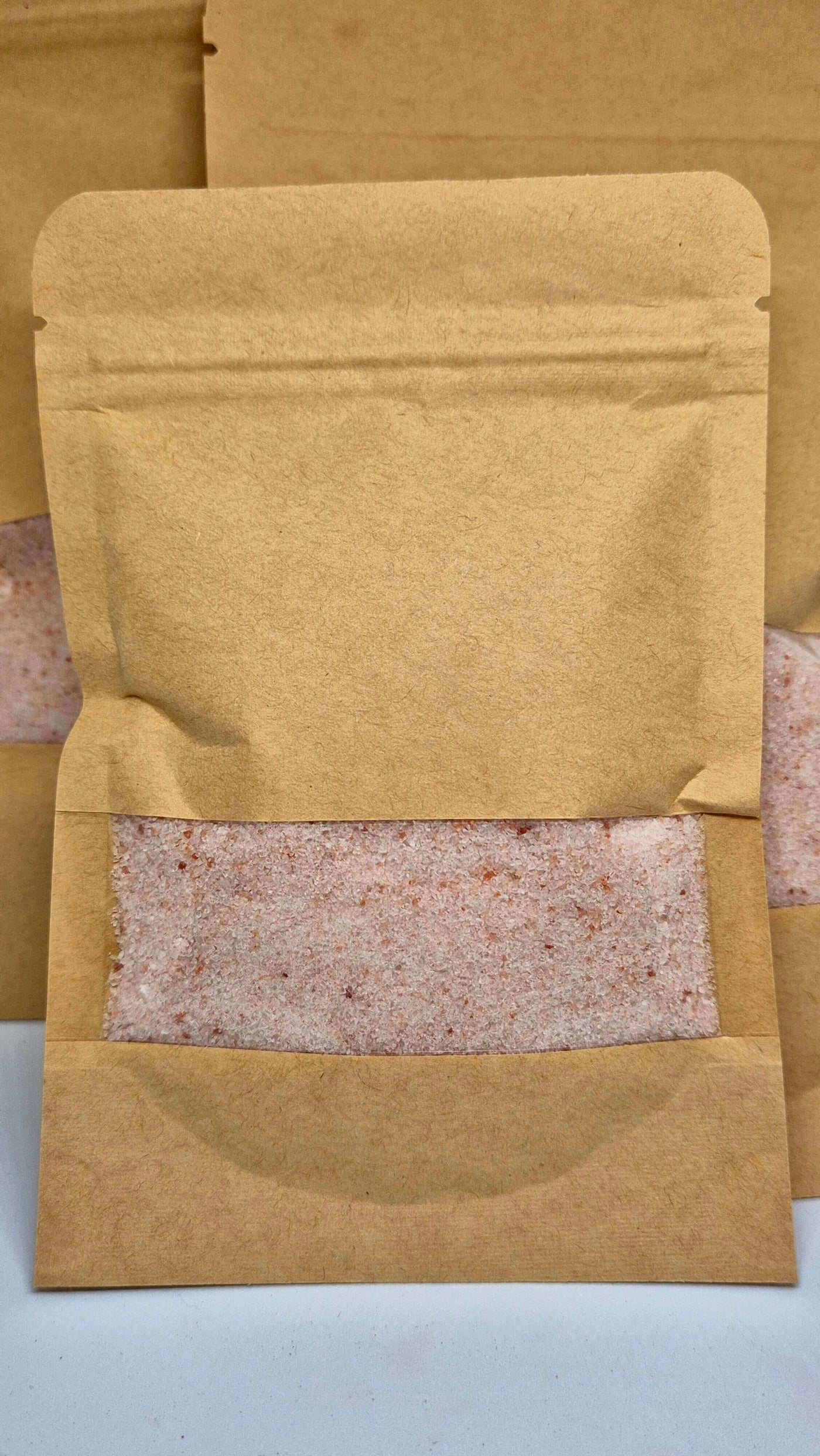 Oat bath salts in a kraft bag, designed for stress relief and skin soothing.