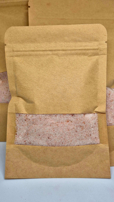 Oat bath salts in a kraft bag, designed for stress relief and skin soothing.